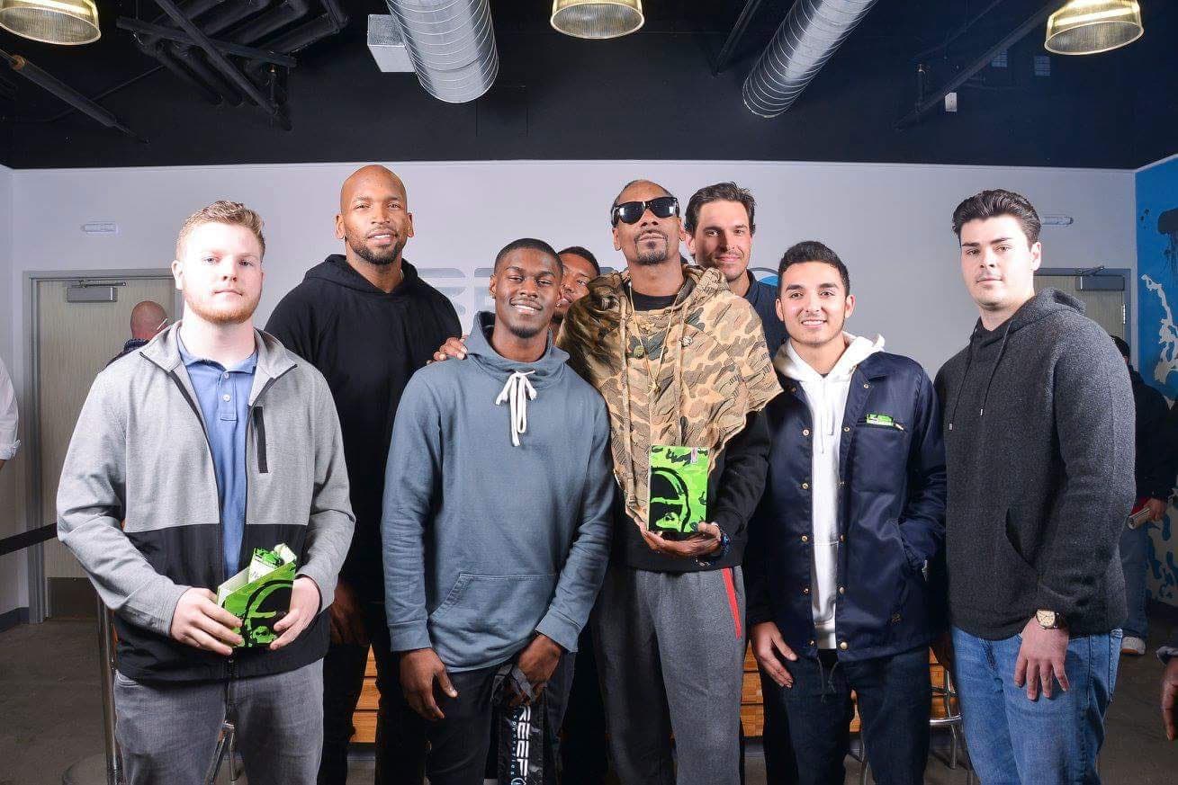 The Code Black crew with Snoop Dogg at a Reef event. Documented — not a cosign.